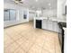 Open kitchen features tile floors and modern appliances at 521 E Cheyenne Rd, San Tan Valley, AZ 85143