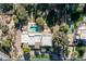 Bird's eye view of the home and surrounding landscape; tennis court visible at 5301 E Roadrunner Rd, Paradise Valley, AZ 85253