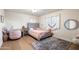 Cozy bedroom with light walls, plush bedding, and a vanity area at 5301 E Roadrunner Rd, Paradise Valley, AZ 85253