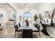 Bright dining room with a long table, access to the outdoors, and a grand chandelier at 5301 E Roadrunner Rd, Paradise Valley, AZ 85253