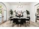 Modern dining room featuring a large square table and sleek black chairs at 5301 E Roadrunner Rd, Paradise Valley, AZ 85253
