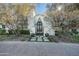 Elegant home with ornate iron front doors and beautifully landscaped entryway at 5301 E Roadrunner Rd, Paradise Valley, AZ 85253