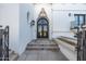 Elegant entryway with arched double doors and stone steps at 5301 E Roadrunner Rd, Paradise Valley, AZ 85253