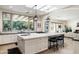 Open kitchen with large island and views to backyard at 5301 E Roadrunner Rd, Paradise Valley, AZ 85253