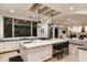 Open kitchen features a sizable island with seating, high-end appliances, and an adjacent Gathering room at 5301 E Roadrunner Rd, Paradise Valley, AZ 85253