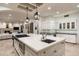 Island kitchen with stainless steel appliances, custom cabinetry, and breakfast bar seating at 5301 E Roadrunner Rd, Paradise Valley, AZ 85253