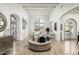 Elegant living room with high ceilings, large windows, and a circular seating area at 5301 E Roadrunner Rd, Paradise Valley, AZ 85253