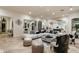 Open living room with a large sectional sofa and access to the kitchen at 5301 E Roadrunner Rd, Paradise Valley, AZ 85253