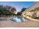 Resort style pool and spa with a covered patio and mountain views at 5301 E Roadrunner Rd, Paradise Valley, AZ 85253