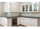 Built-in wet bar with wine cooler and gray countertops at 5301 E Roadrunner Rd, Paradise Valley, AZ 85253