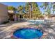 Community pool and spa with lounge chairs and patio tables at 6350 N 78Th St # 256, Scottsdale, AZ 85250