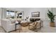 Cozy living room featuring a white sectional sofa and wood accents at 7396 W Whitehorn Trl, Peoria, AZ 85383