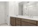 Elegant bathroom with double vanity and large mirror at 7416 W Quail Track Dr, Peoria, AZ 85383