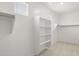 Bright walk-in closet with built-in shelving at 7446 W Whitehorn Trl, Peoria, AZ 85383