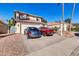 Two-story house with a two-car garage and desert landscaping at 910 W San Mateo Ct, Gilbert, AZ 85233