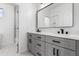 Modern bathroom with double vanity and grey cabinets at 135 E Julian Dr, Gilbert, AZ 85295