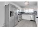 Modern kitchen with stainless steel appliances and white cabinets at 2348 E Palm Beach Dr, Chandler, AZ 85249