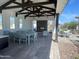 Covered outdoor community space with fireplace and seating at 2624 E Dutchmans Trl, Apache Junction, AZ 85119