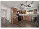 Open kitchen with wood cabinets and granite countertops at 44824 N 10Th St, New River, AZ 85087