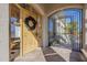 Building entrance with decorative gate and welcoming wreath at 7777 E 2Nd St # 111, Scottsdale, AZ 85251