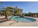 Enjoy this refreshing community pool with palm trees and seating area at 7777 E 2Nd St # 111, Scottsdale, AZ 85251