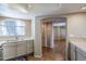 Kitchen features light cabinets, stainless steel appliances, and a breakfast bar at 7777 E 2Nd St # 111, Scottsdale, AZ 85251