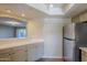 Kitchen with stainless steel refrigerator and light-colored cabinets at 7777 E 2Nd St # 111, Scottsdale, AZ 85251