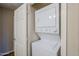 Stackable washer and dryer in a well-lit laundry closet at 7777 E 2Nd St # 111, Scottsdale, AZ 85251