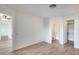 Bedroom features a view, laminate floors and access to bath at 14300 W Bell Rd # 65, Surprise, AZ 85374