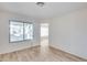 Bright bedroom with laminate flooring and exterior access at 14300 W Bell Rd # 65, Surprise, AZ 85374