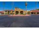 Palm trees and building entrance with a car at 14300 W Bell Rd # 65, Surprise, AZ 85374