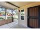 Covered entryway with security door and view of neighborhood at 14300 W Bell Rd # 65, Surprise, AZ 85374