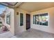 Condo entrance with security door and windows at 14300 W Bell Rd # 65, Surprise, AZ 85374