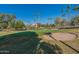 Golf course view with sand trap and palm trees at 14300 W Bell Rd # 65, Surprise, AZ 85374