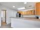 Kitchen boasts wood cabinets, stainless steel appliances, and a breakfast bar at 14300 W Bell Rd # 65, Surprise, AZ 85374