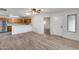 Bright living room with laminate flooring and ceiling fan at 14300 W Bell Rd # 65, Surprise, AZ 85374