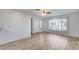 Living room features laminate flooring, a window, and a door at 14300 W Bell Rd # 65, Surprise, AZ 85374