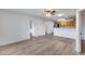 Living room with light wood laminate flooring and ceiling fan at 14300 W Bell Rd # 65, Surprise, AZ 85374