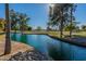 Peaceful pond view with lush green trees at 14300 W Bell Rd # 65, Surprise, AZ 85374