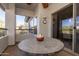 Private balcony with round table and ceiling fan at 33550 N Dove Lakes Dr # 2026, Cave Creek, AZ 85331