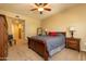 Bright bedroom with wooden furniture and ceiling fan at 33550 N Dove Lakes Dr # 2026, Cave Creek, AZ 85331