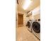Bright laundry room with washer, dryer, and cabinets at 33550 N Dove Lakes Dr # 2026, Cave Creek, AZ 85331