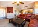 Living room with leather sectional and coffee table at 33550 N Dove Lakes Dr # 2026, Cave Creek, AZ 85331