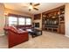 Spacious living area with a fireplace and large TV at 33550 N Dove Lakes Dr # 2026, Cave Creek, AZ 85331