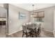 Dining area with light wood floors and a chandelier at 3829 S Harlan --, Mesa, AZ 85212