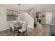 Formal dining room with wood floors, chandelier, and gray chairs at 3829 S Harlan --, Mesa, AZ 85212