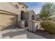 Front entrance with arched entryway and side gate to the driveway at 3829 S Harlan --, Mesa, AZ 85212