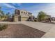 Two-story house with beige exterior, three-car garage, and landscaped front yard at 3829 S Harlan --, Mesa, AZ 85212