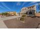 Two story home with a large driveway and landscaped yard at 3829 S Harlan --, Mesa, AZ 85212