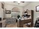Home office with wood desk, computer, and ample storage at 3829 S Harlan --, Mesa, AZ 85212